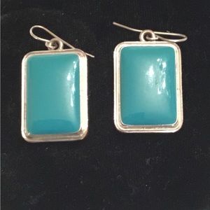 Geometric rectangular earrings in silver and turquoise colors.